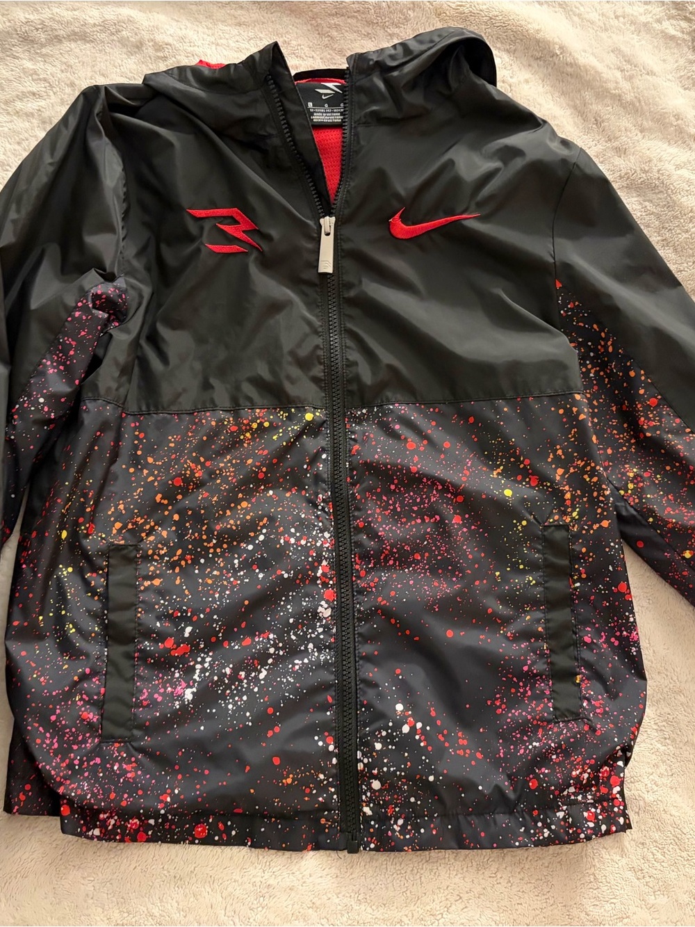 Nike Kids Black Hooded Windbreaker with Red and Multicolor Splatter